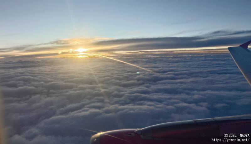 帰りの機上の日の入り